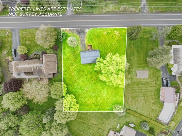 aerial view of property and surrounding area featuring property boundaries highlighted
