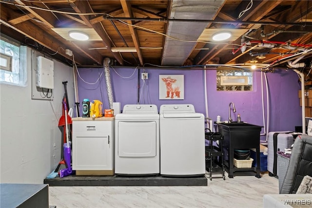 laundry area featuring washer and dryer and cabinet space