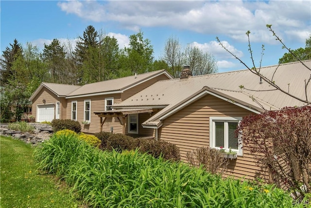 174 Camp Rd, Litchfield, NY 13322 - view of front facade with an attached garage and a chimney