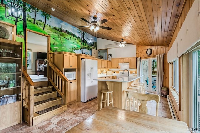 174 Camp Rd, Litchfield, NY 13322 - kitchen with white appliances, lofted ceiling, a baseboard radiator, light countertops, and ceiling fan