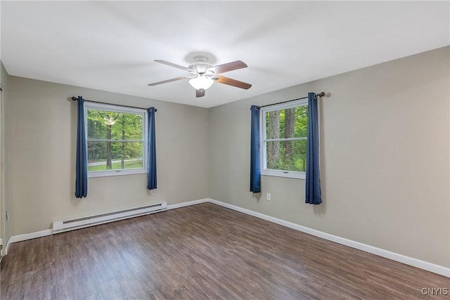 empty room featuring a baseboard radiator, a ceiling fan, wood finished floors, and baseboards
