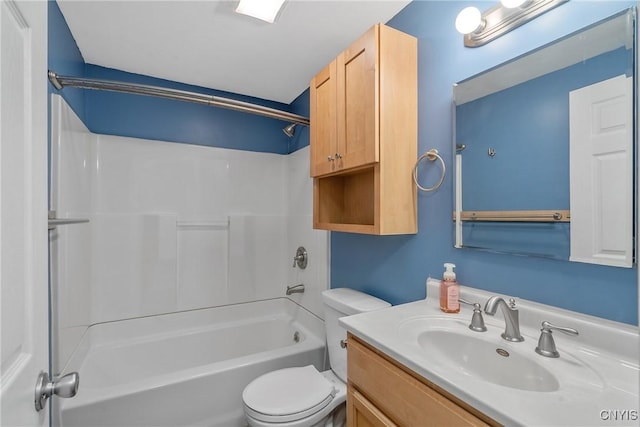 full bathroom featuring toilet, vanity, and washtub / shower combination