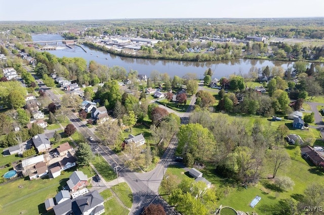 aerial view of property and surrounding area featuring a large body of water