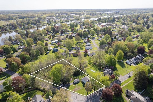 aerial view of property's location featuring a nearby body of water and property parcel outlined