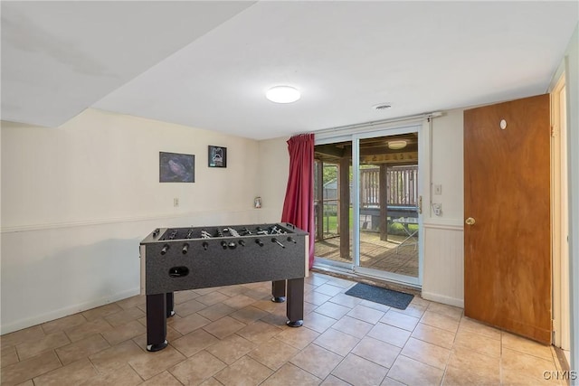 rec room featuring a wainscoted wall