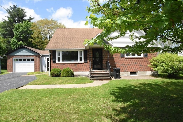 806 Mount Zoar St, Southport, NY 14904 - view of front facade with a front lawn, an attached garage, brick siding, and asphalt driveway