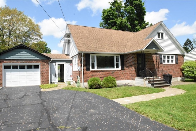 806 Mount Zoar St, Southport, NY 14904 - view of front of home with driveway, a garage, brick siding, a front lawn, and roof with shingles