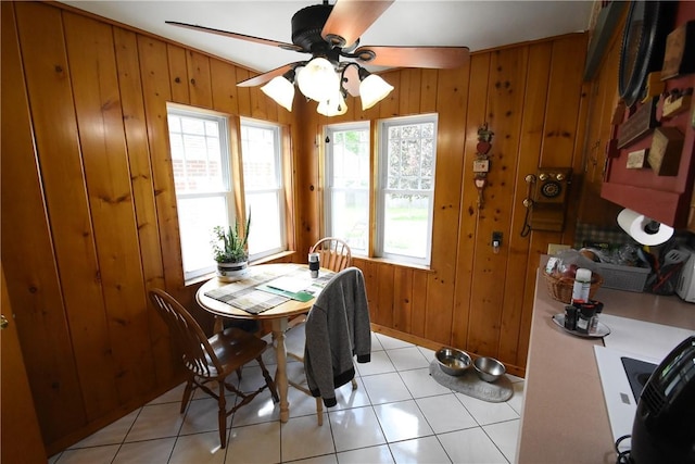 806 Mount Zoar St, Southport, NY 14904 - dining space with a ceiling fan, wood walls, and light tile patterned floors