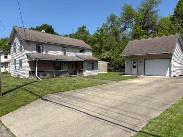 214 Main St, Erwin, NY 14827 - view of front facade with a porch, an outdoor structure, concrete driveway, and a front lawn