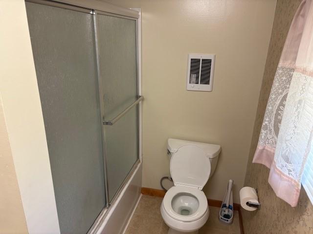 214 Main St, Erwin, NY 14827 - bathroom featuring baseboards, toilet, and combined bath / shower with glass door
