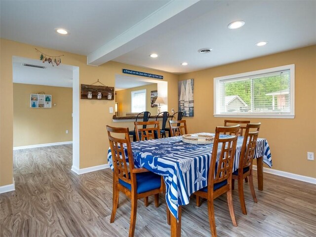 8521 W Buckingham St, Richmond, NY 14471 - dining space featuring wood finished floors, plenty of natural light, baseboards, recessed lighting, and beam ceiling