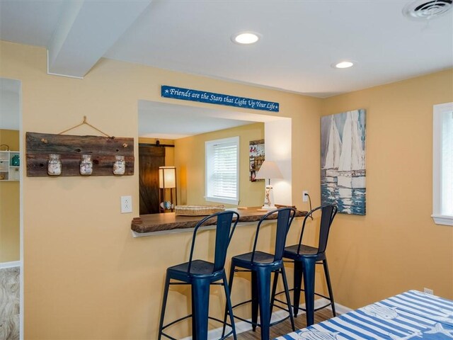 8521 W Buckingham St, Richmond, NY 14471 - dining area with bar with sink, baseboards, and recessed lighting