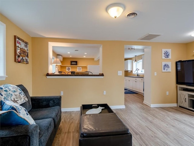 8521 W Buckingham St, Richmond, NY 14471 - living room with light wood finished floors, baseboards, and recessed lighting