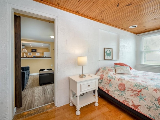 8521 W Buckingham St, Richmond, NY 14471 - bedroom with wood finished floors, wooden ceiling, and ornamental molding