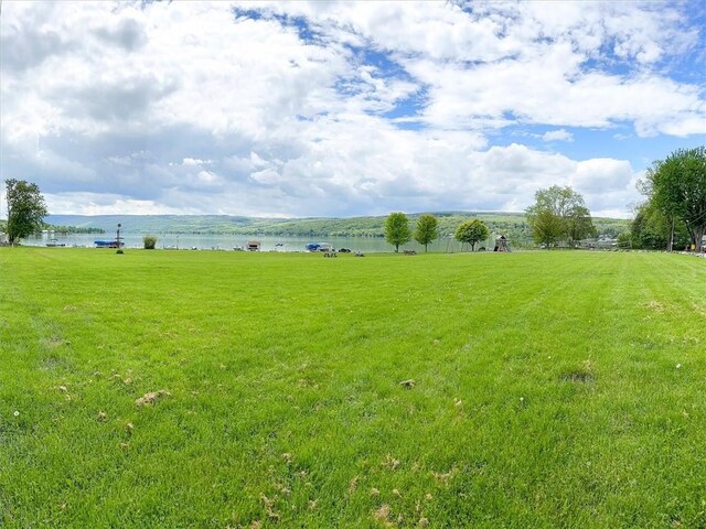 8521 W Buckingham St, Richmond, NY 14471 - view of green lawn with a water view