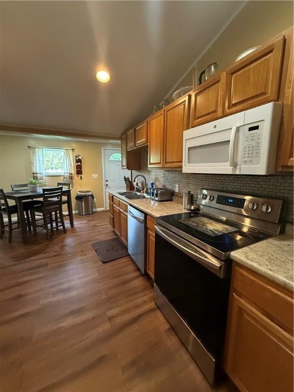 760 Spruce St, Southport, NY 14904 - kitchen with appliances with stainless steel finishes, backsplash, light countertops, dark wood finished floors, and recessed lighting