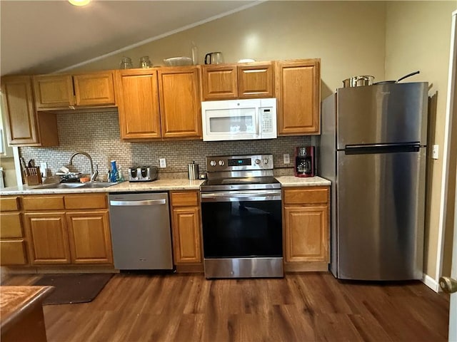 760 Spruce St, Southport, NY 14904 - kitchen with stainless steel appliances, vaulted ceiling, dark wood-style flooring, and light countertops
