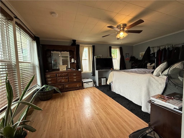 760 Spruce St, Southport, NY 14904 - bedroom with ornamental molding, wood finished floors, and a ceiling fan