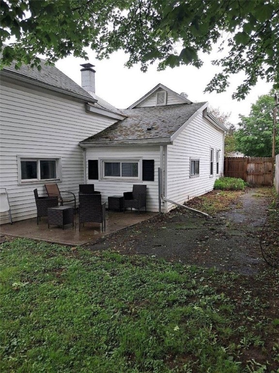 760 Spruce St, Southport, NY 14904 - rear view of property featuring a chimney and a patio area