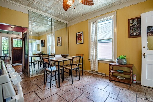 18 Avery Pl, Utica, NY 13502 - dining room with plenty of natural light, baseboards, a ceiling fan, and an ornate ceiling