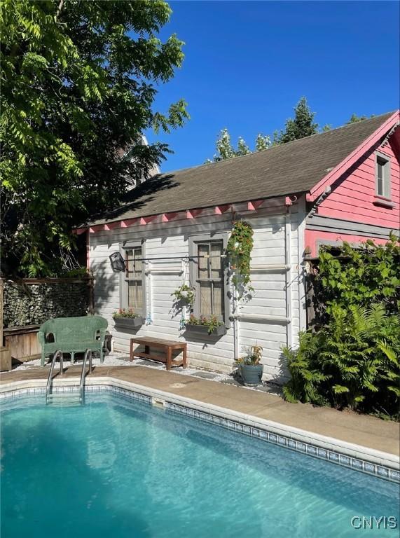 18 Avery Pl, Utica, NY 13502 - swimming pool with an outbuilding