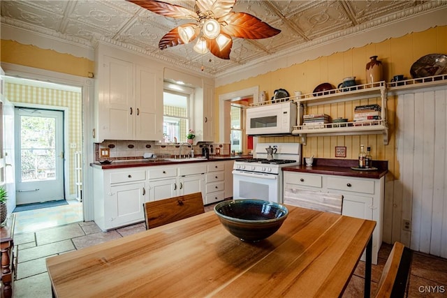18 Avery Pl, Utica, NY 13502 - kitchen with white appliances, open shelves, an ornate ceiling, ceiling fan, and white cabinetry