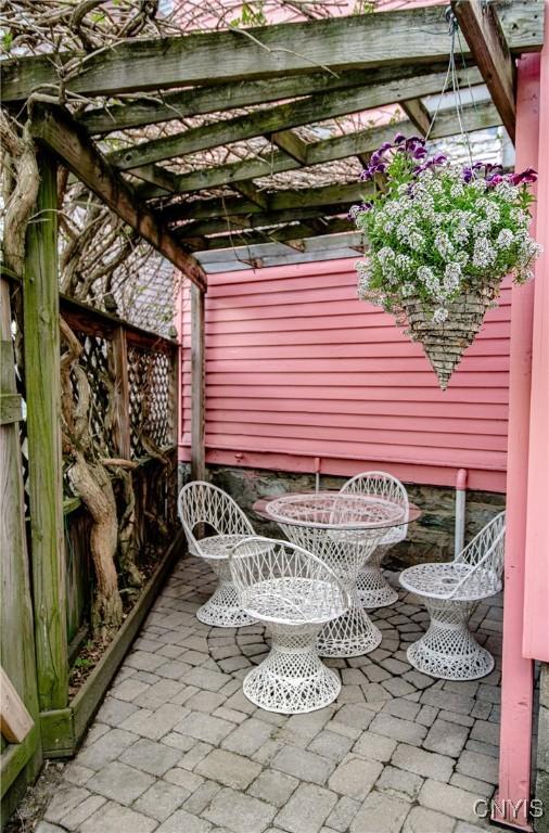18 Avery Pl, Utica, NY 13502 - view of patio with a pergola and outdoor dining area