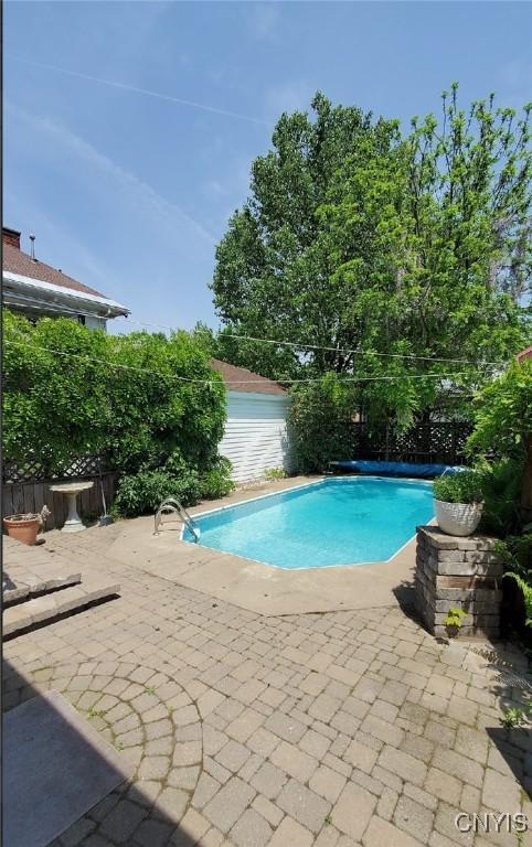18 Avery Pl, Utica, NY 13502 - view of pool featuring a patio area and a fenced backyard