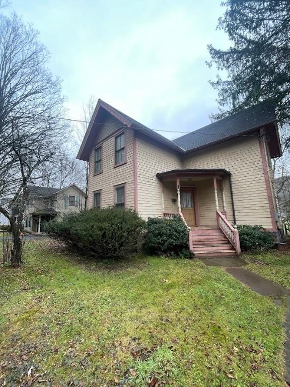 211 Main St, Delhi, NY 13753 - view of front of house with a porch and a front yard