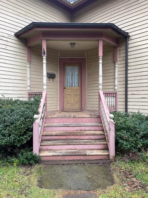 211 Main St, Delhi, NY 13753 - property entrance featuring a porch