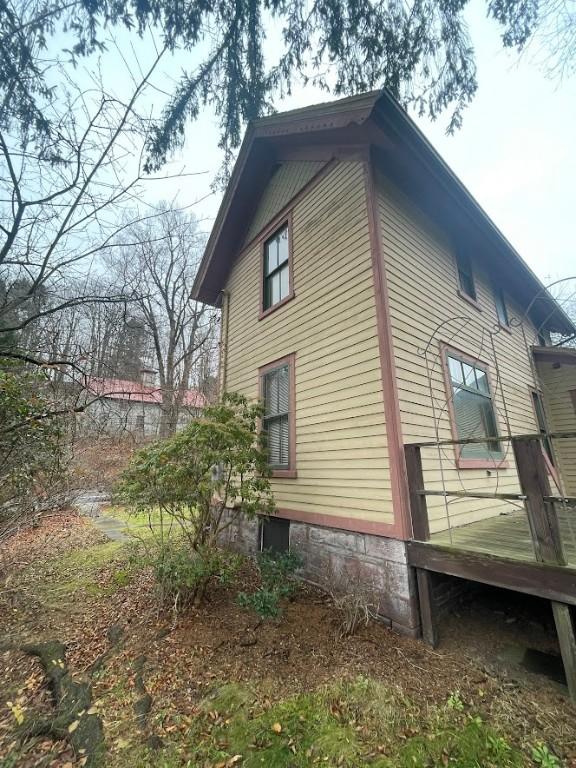 211 Main St, Delhi, NY 13753 - view of side of home with a wooden deck