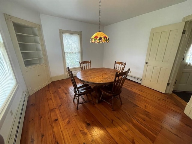211 Main St, Delhi, NY 13753 - dining room featuring a baseboard radiator and hardwood / wood-style floors