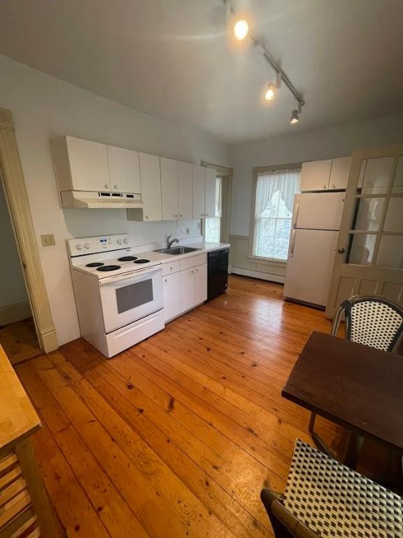 211 Main St, Delhi, NY 13753 - kitchen featuring white appliances, a sink, light wood finished floors, rail lighting, and light countertops