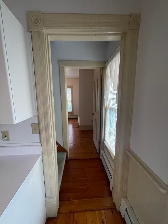 211 Main St, Delhi, NY 13753 - hall featuring a baseboard radiator, plenty of natural light, and light wood-type flooring