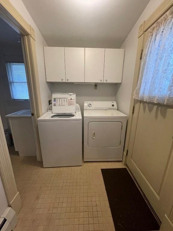 211 Main St, Delhi, NY 13753 - washroom with washer and dryer, cabinet space, and light tile patterned floors