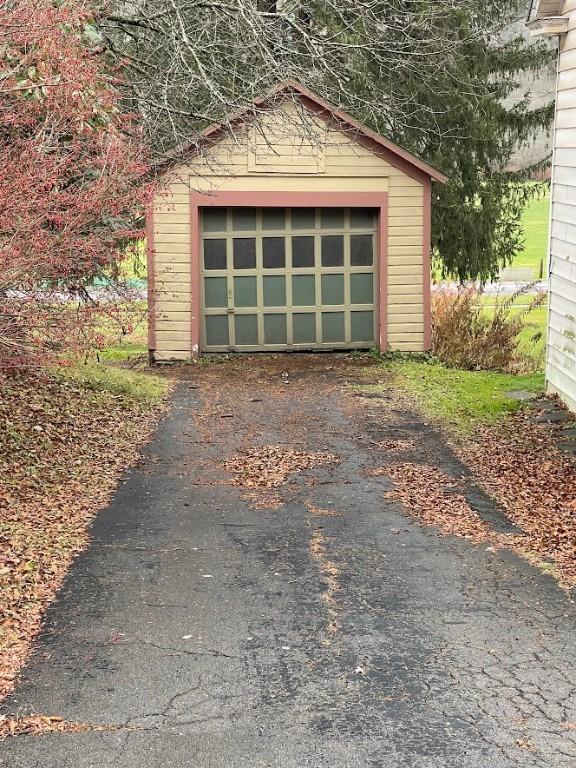 211 Main St, Delhi, NY 13753 - detached garage featuring asphalt driveway