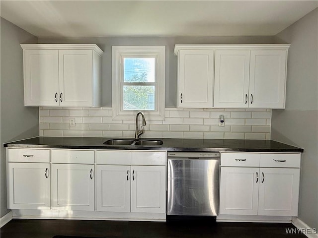 101 Spruce St, Lackawanna, NY 14218 - kitchen featuring stainless steel dishwasher, a sink, white cabinets, and dark countertops