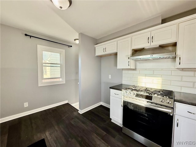 101 Spruce St, Lackawanna, NY 14218 - kitchen with gas stove, under cabinet range hood, dark countertops, baseboards, and decorative backsplash