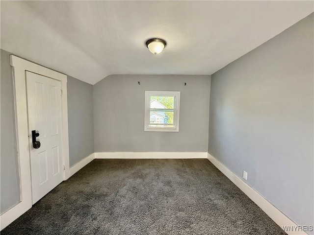 101 Spruce St, Lackawanna, NY 14218 - unfurnished room with dark carpet, vaulted ceiling, and baseboards