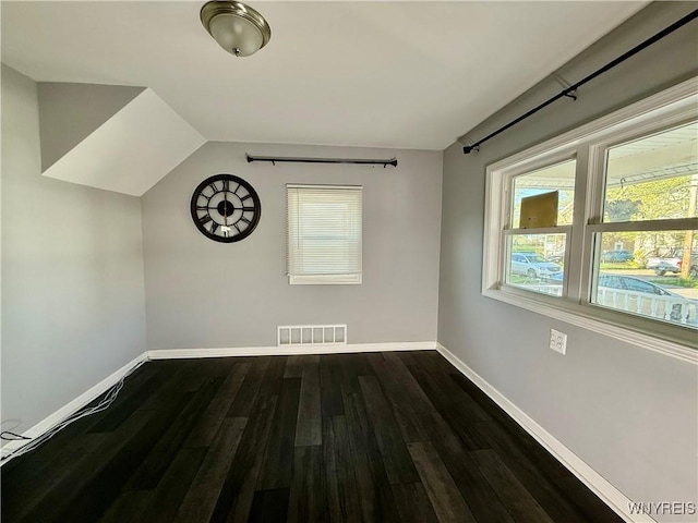 101 Spruce St, Lackawanna, NY 14218 - unfurnished room featuring baseboards, dark wood-style floors, and lofted ceiling