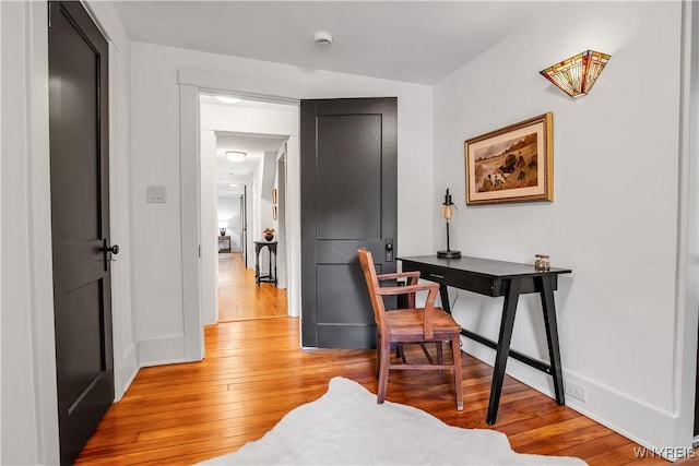 office space featuring light wood finished floors and baseboards