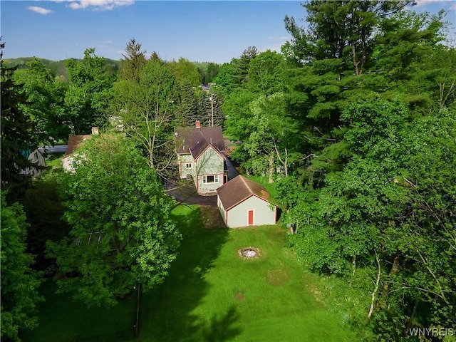 view from above of property with a heavily wooded area