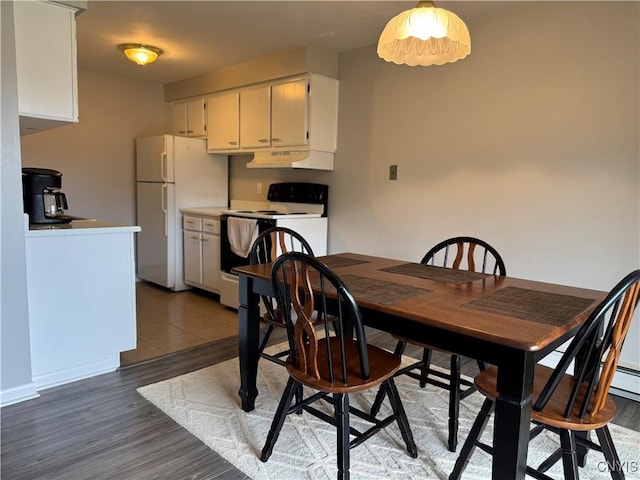 dining area featuring light wood finished floors