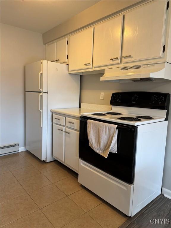 kitchen featuring range with electric cooktop, a baseboard radiator, under cabinet range hood, and white cabinets