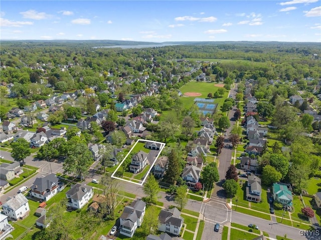 aerial perspective of suburban area featuring property parcel outlined and a forest