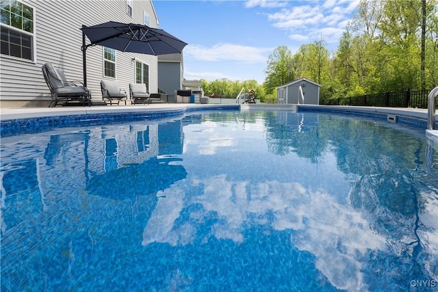 view of pool with fence