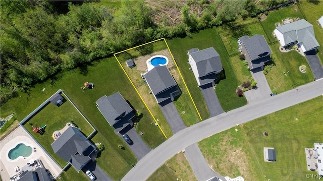 aerial overview of property's location with a pool area and property boundaries highlighted
