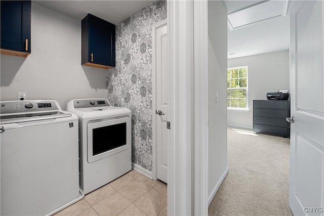 clothes washing area featuring cabinet space, washer and clothes dryer, attic access, and baseboards
