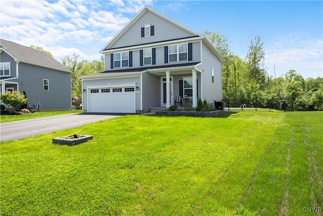 view of front of property featuring asphalt driveway, a garage, a front lawn, a porch, and cooling unit