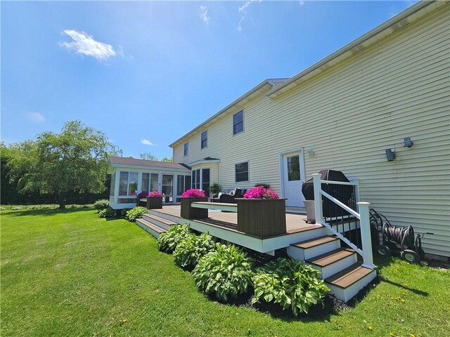 4862 Cross St, Campbell, NY 14821 - back of house with a deck, a yard, and a sunroom